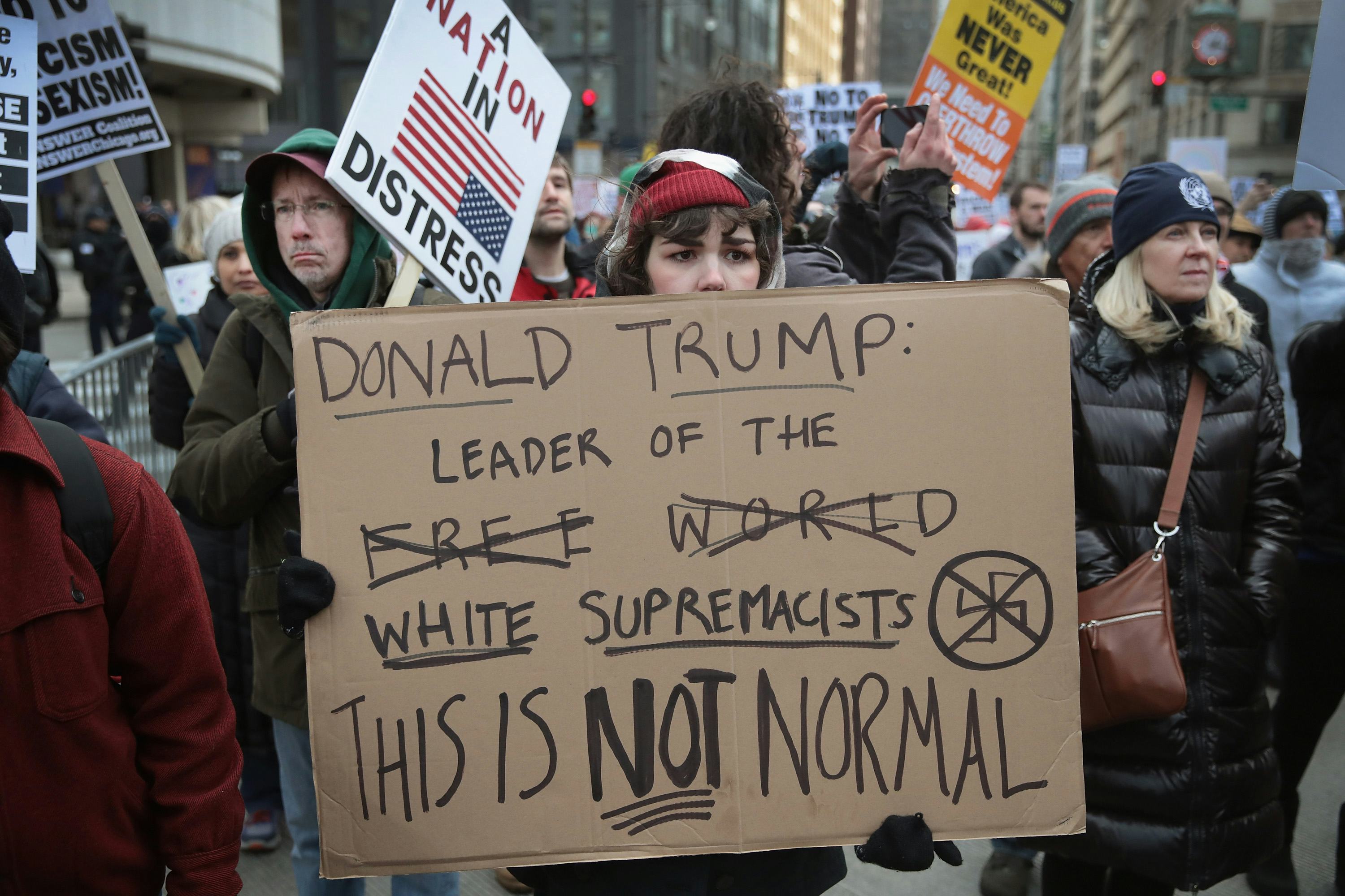 US President gives heated defence of first month in office