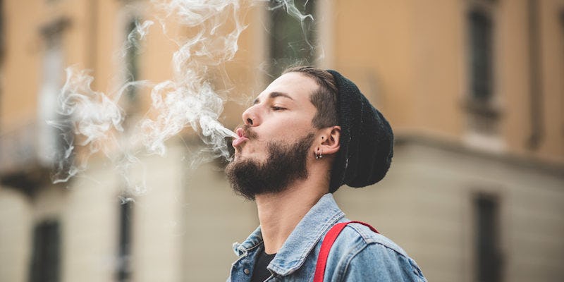 Guy-Smoking-Weed-Public.jpg?w=748&h=448&