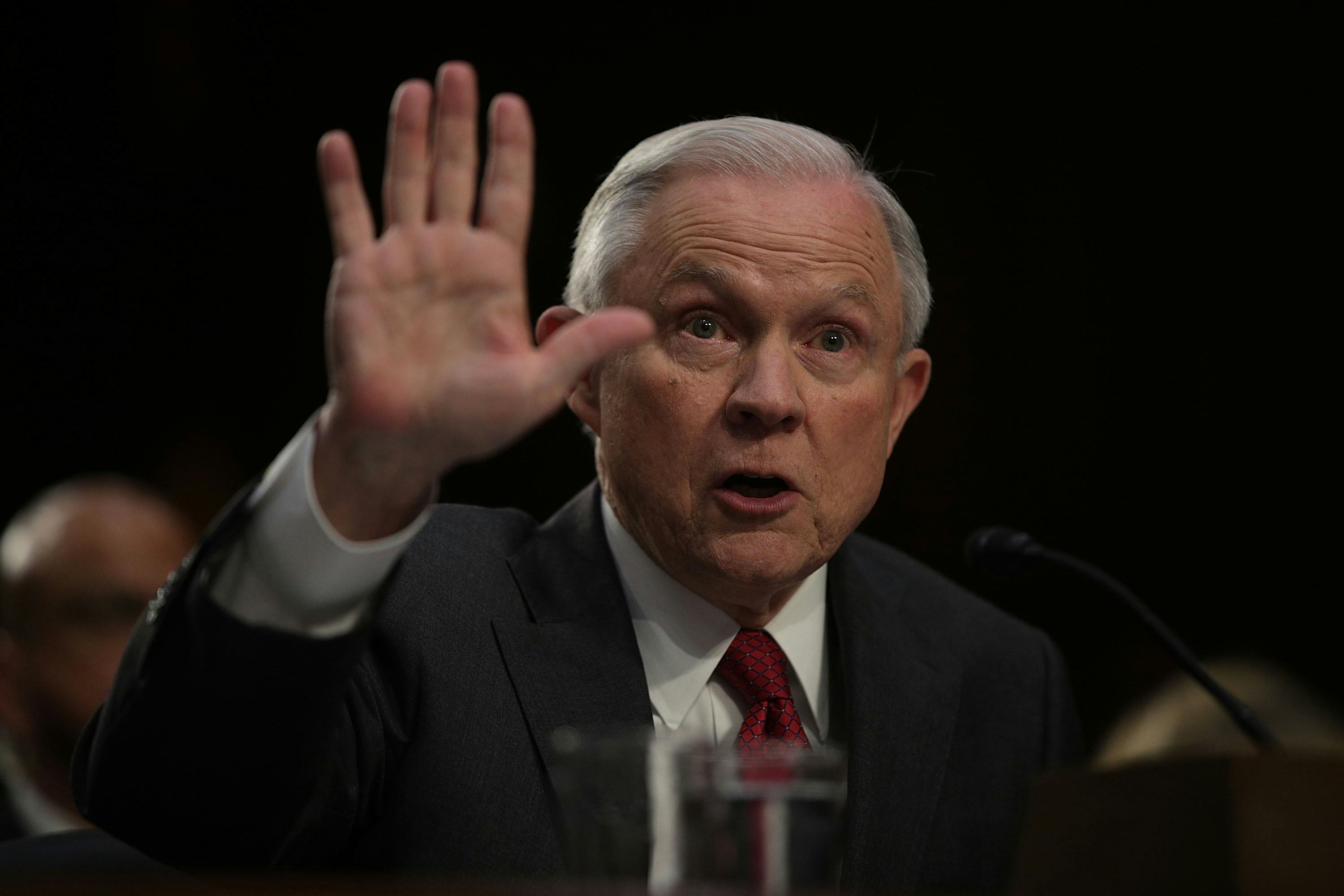 Prosecutors drop criminal case against activist arrested after laughing at Sessions Prosecutors drop criminal case against activist arrested after laughing at Sessions