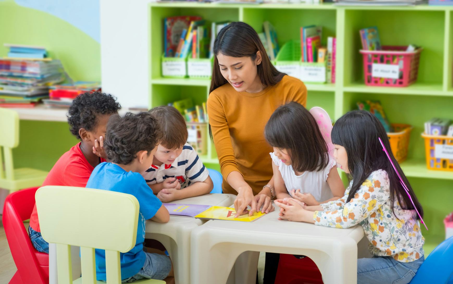 teacher at table with kids